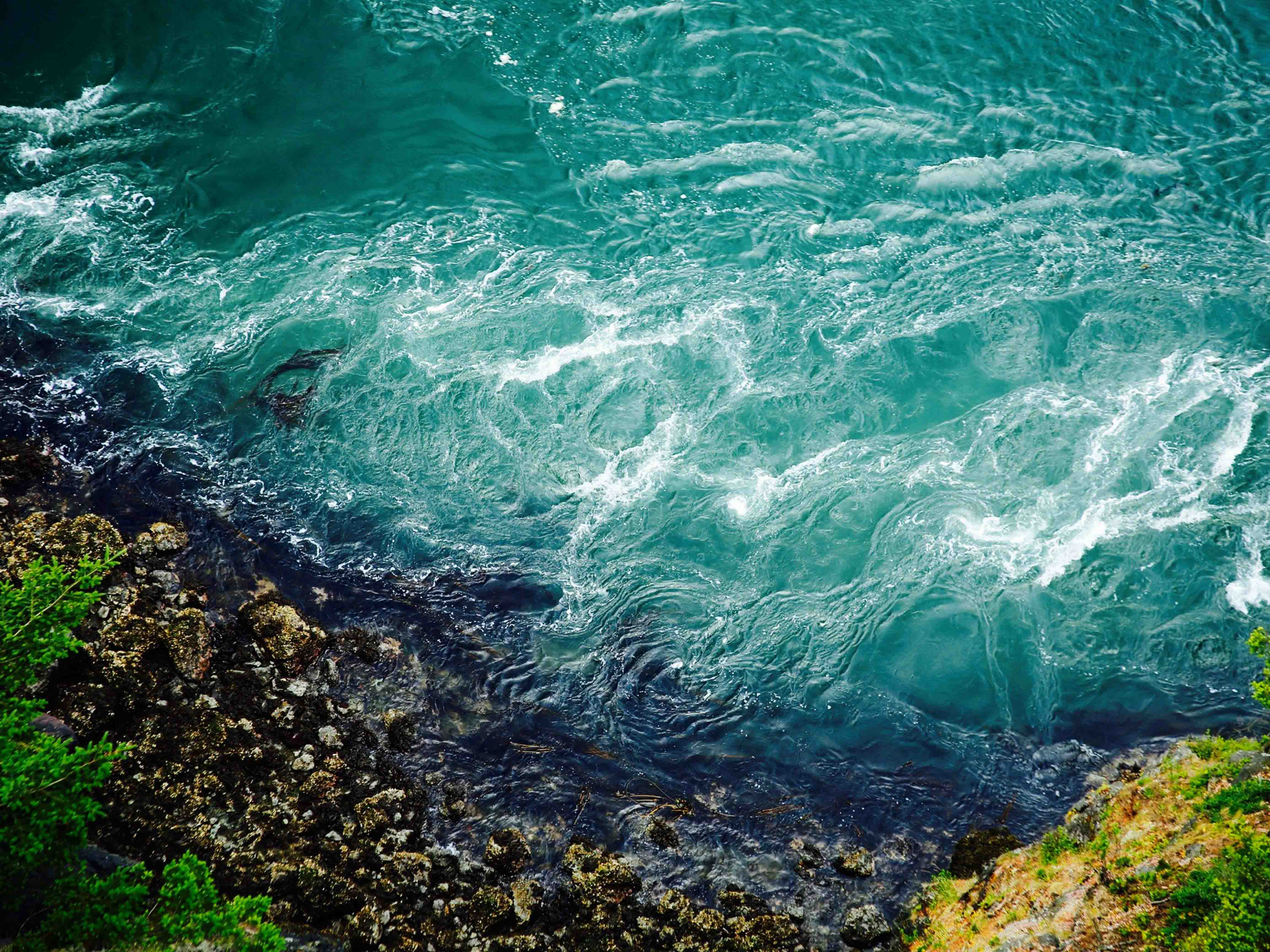 Ocean Water Crashing on Rocky Shore