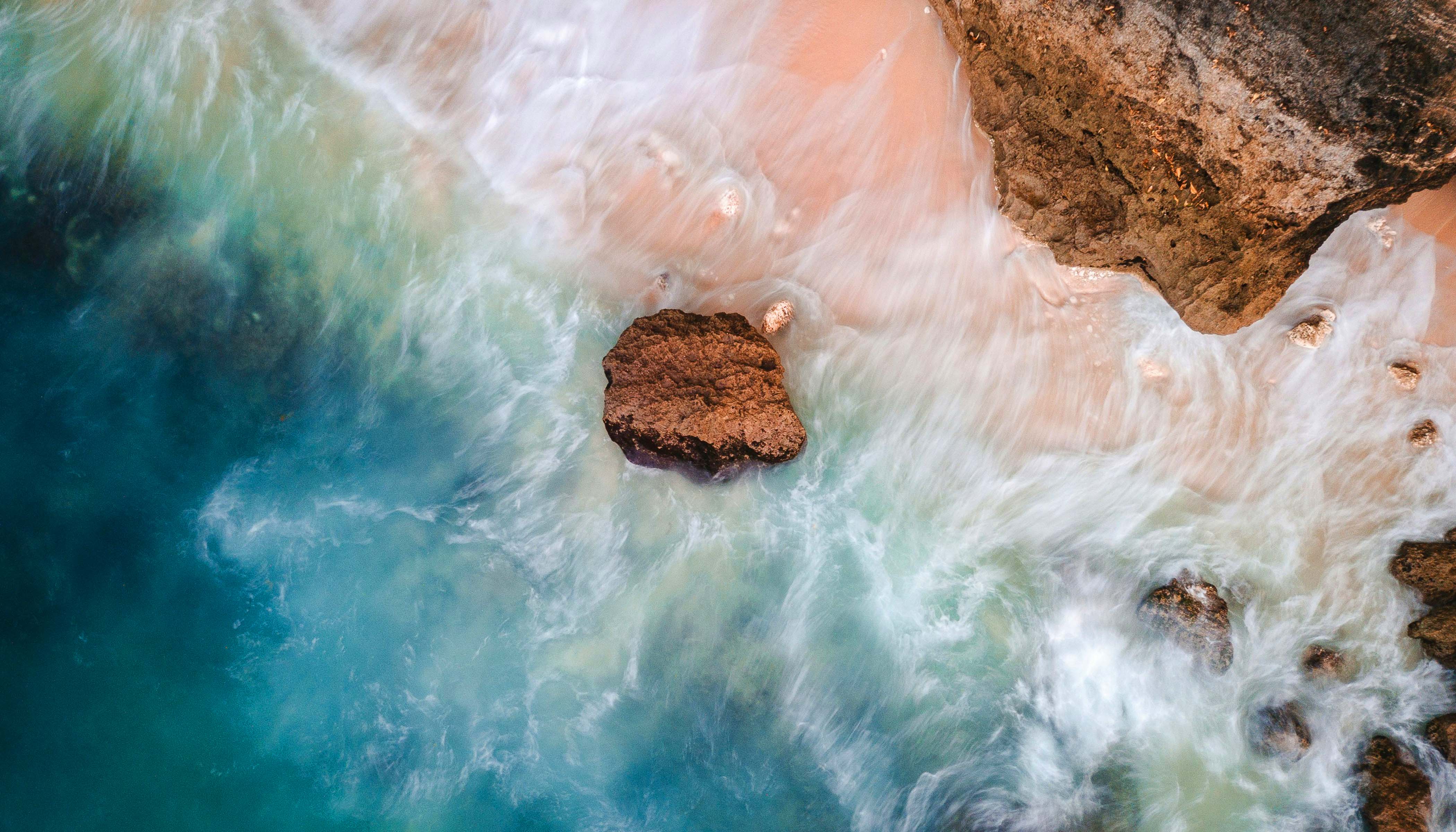 Aerial Photograph of Waves Crashing on the Beach