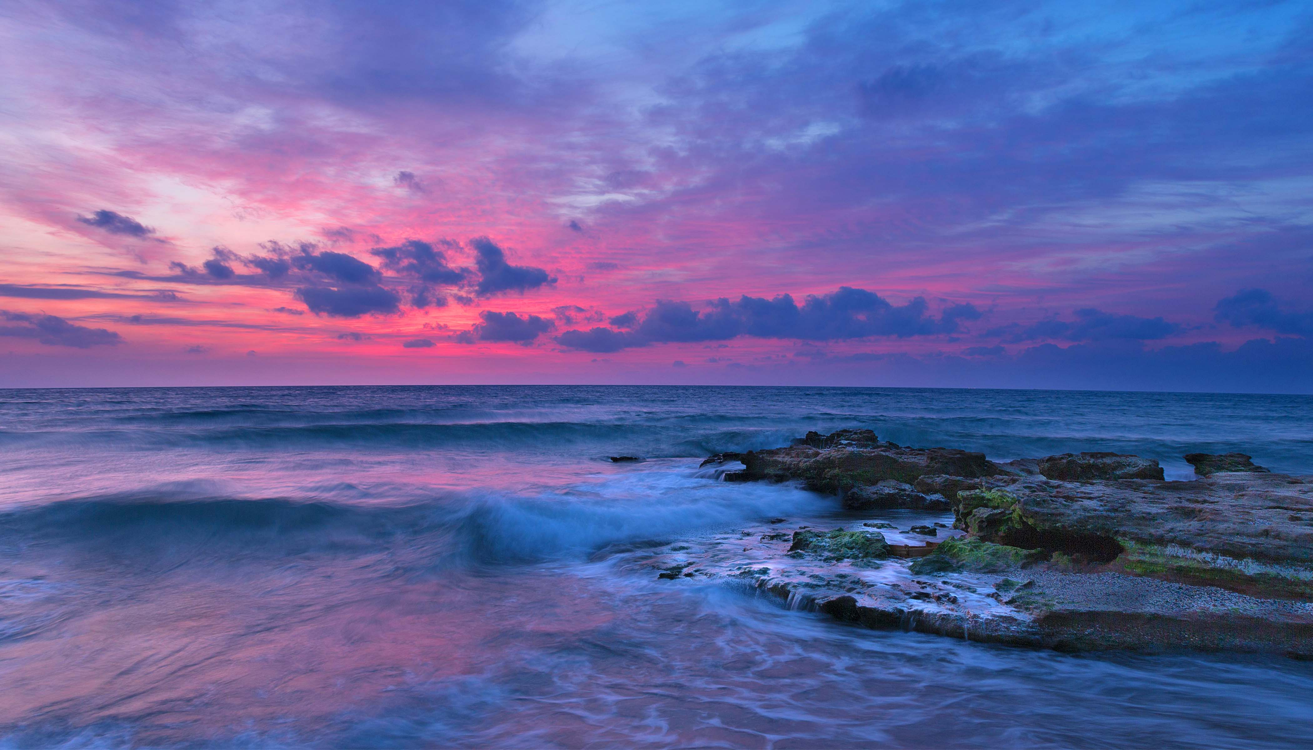 A Purple and Pink Sunset Over the Ocean A Purple and Pink Sunset Over the Ocean